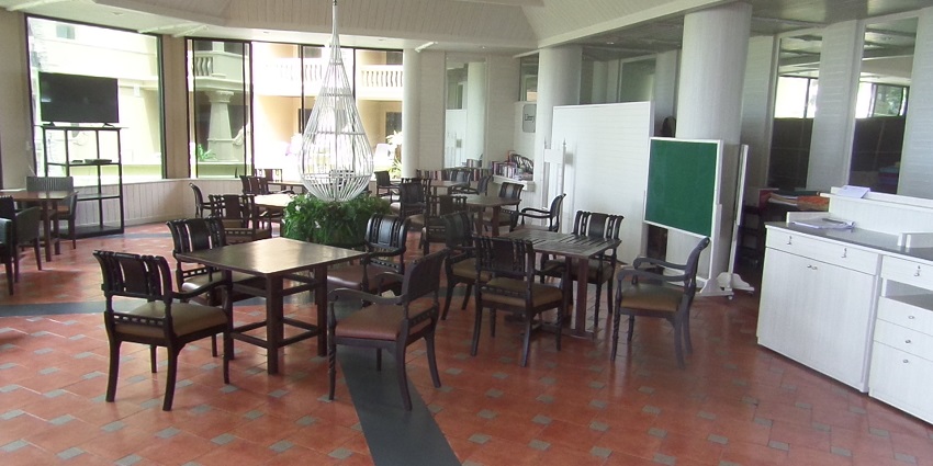 Inside a local restaurant with wooden chairs near the Vedvyas temple in Odisha.