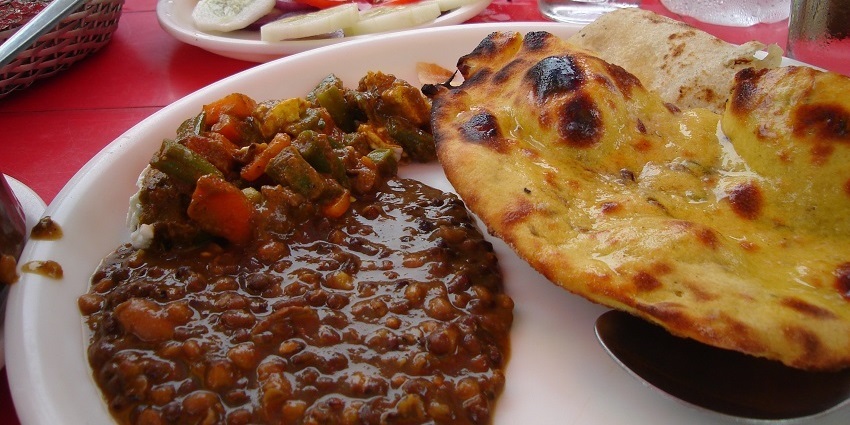 Thali served at a dhaba nearby, naan with chole curry and a salad of cucumber and tomatoes
