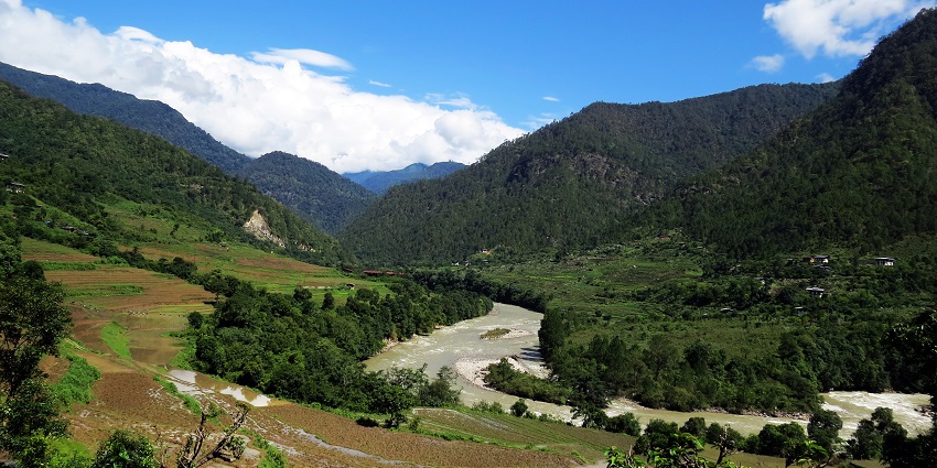 The tranquil Mo Chu River, flowing through Jigme Dorji National Park, enhancing the park's ecosystem.