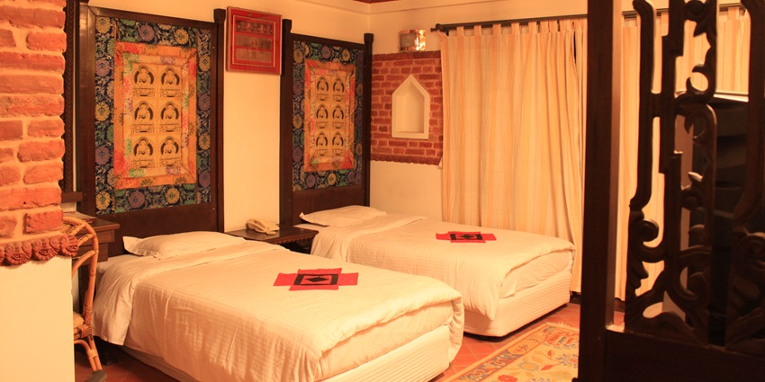 Hotel Manaslu, a modern hotel in Nepal, with a view of the Himalayas in the distance.