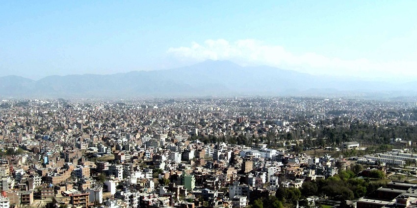 A beautiful view of Kathmandu filled with traditional buildings during a clear day.