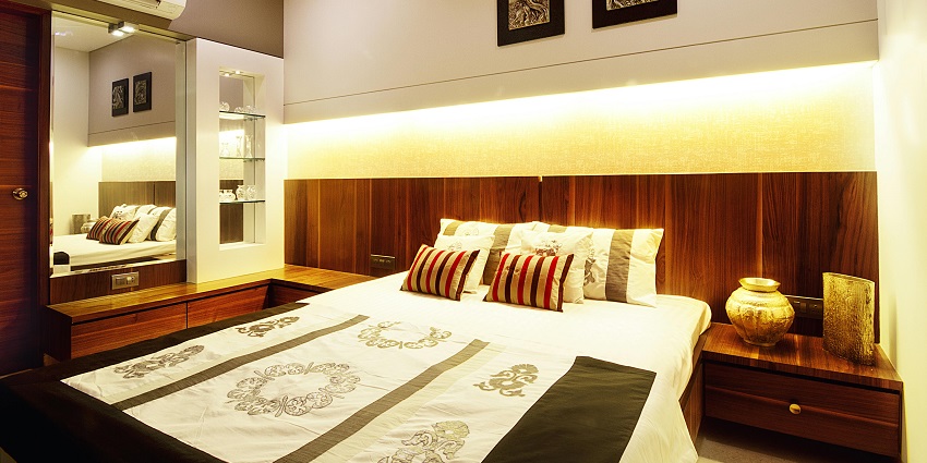 Elegant hotel room interior with modern furnishings, soft lighting, and a stylish decor