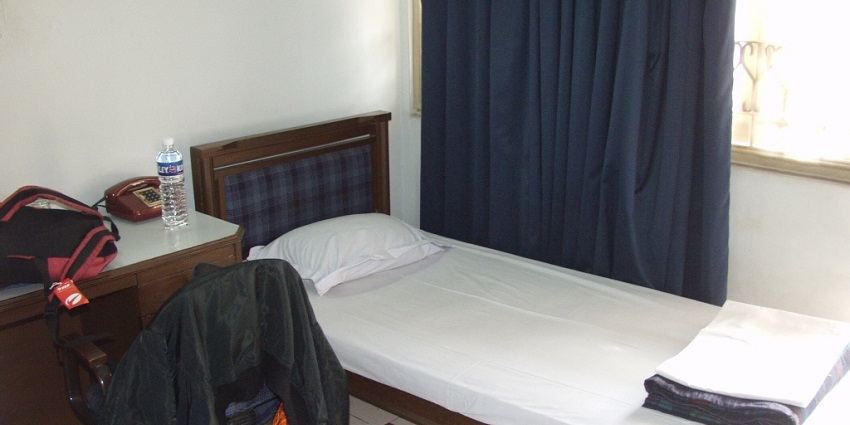 A cosy room, ideal for travellers seeking comfort in Berhampur hotels.