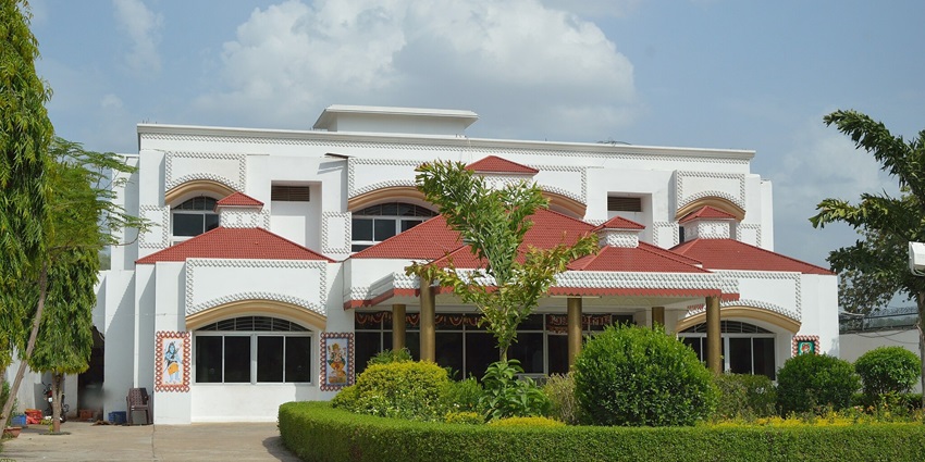 Snapshot of the Ram Durbar hotel surrounded by the beautiful garden under a scenic sky