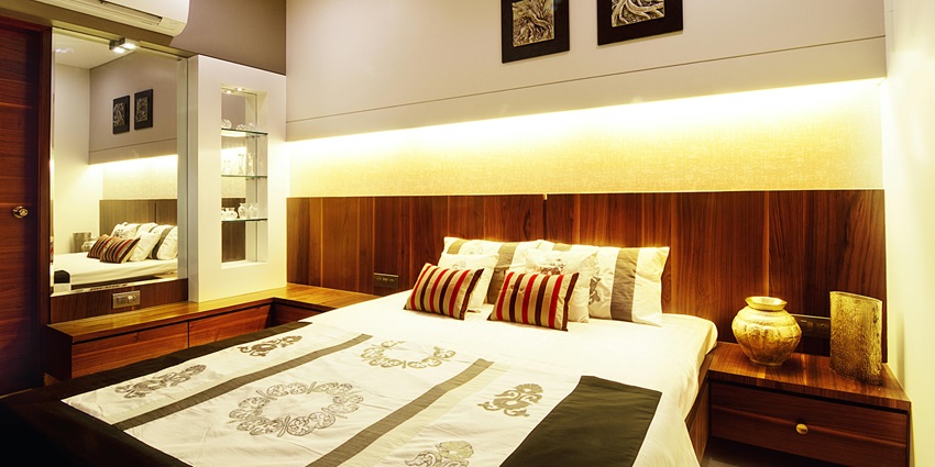 Hotel room with comfortable furnishings, ideal for visitors to the Dolls Museum Rajkot.