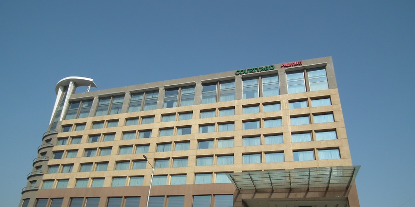 A lower angle view of the Courtyard Marriott in Ahmedabad where you can stay