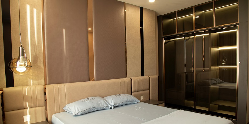 image of a hotel room with clean white bedsheets and beautiful ambience