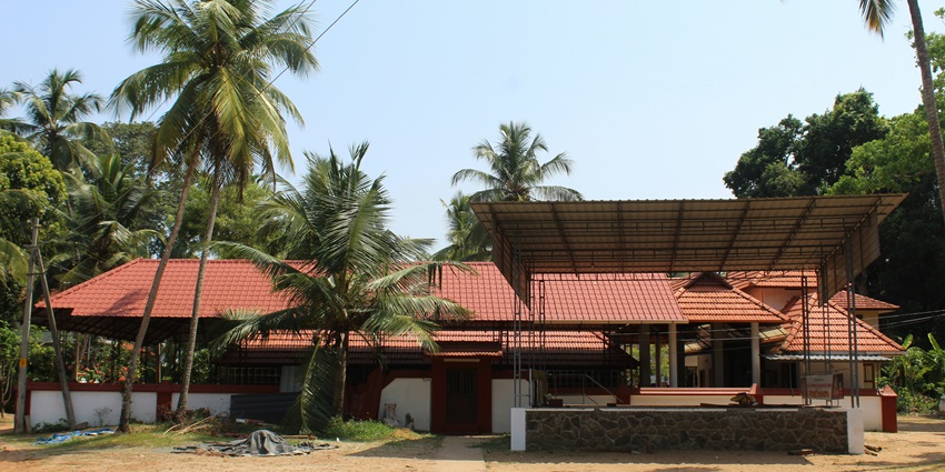An amazing view of a hotel in Kerala with stunning architecture and views during the day.