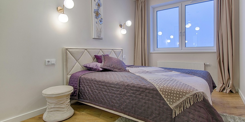 Elegant room with a plush bed and stylish wooden floors, offering ultimate luxury.