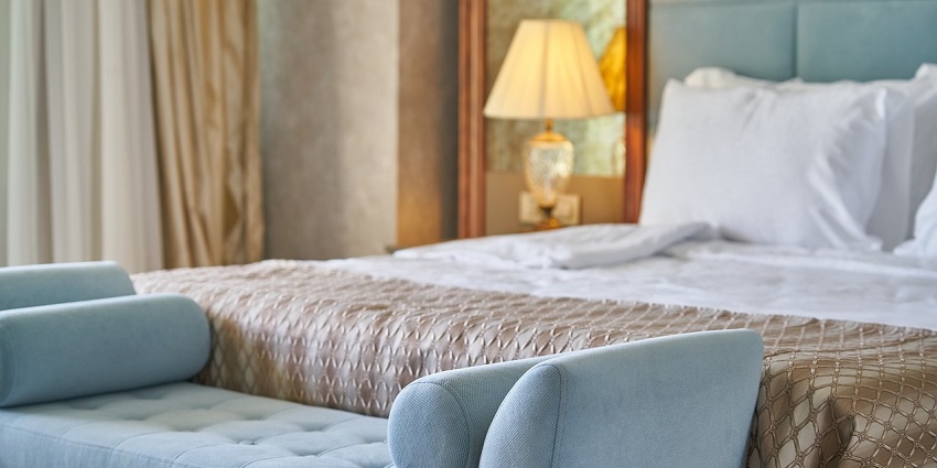 Stylish hotel room with premium decor, offering ultimate relaxation near Gyan Museum.