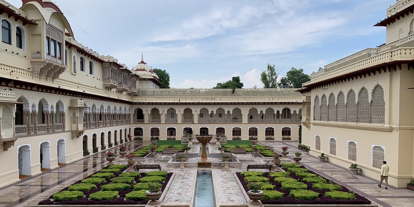 View of the lobby of the Rambagh Palace hotel, a luxurious hotel to stay in Rajasthan.