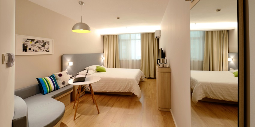Chic and cosy hotel room with plush bedding, ideal for a relaxing and stylish getaway