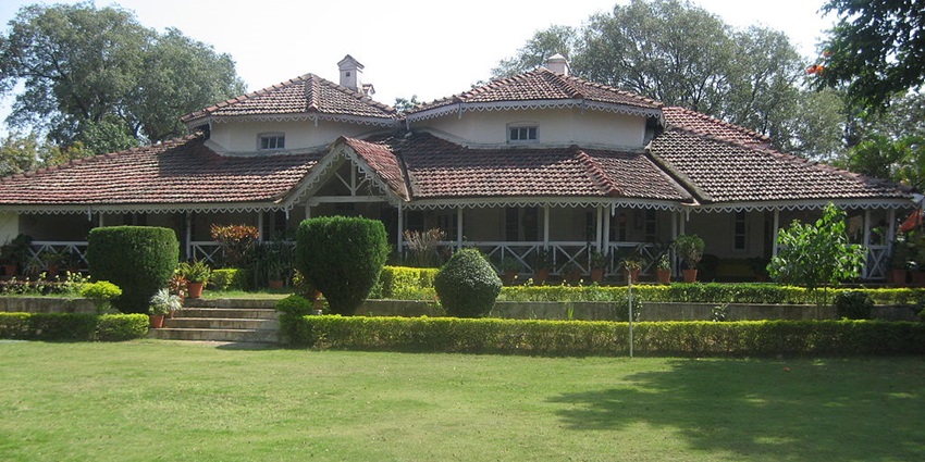 Satpura Retreat Hotel in Madhya Pradesh with its colonial-style architecture and lush greenery.