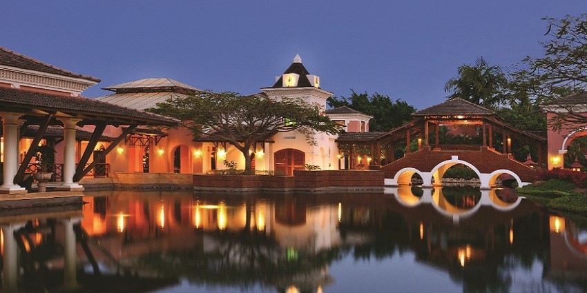 A view of Park Hyatt Goa Resort and Spa, featuring elegant low-rise buildings with terracotta-tiled roofs