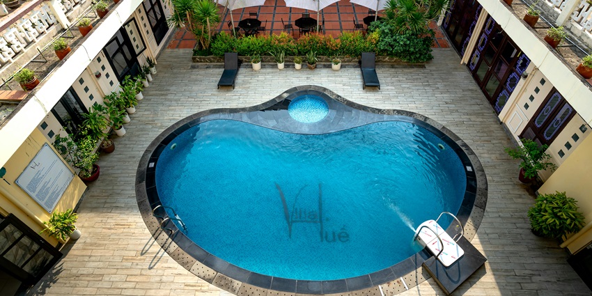 An image of a swimming pool in a hotel, an accommodation near the majestic Ajmer Fort.
