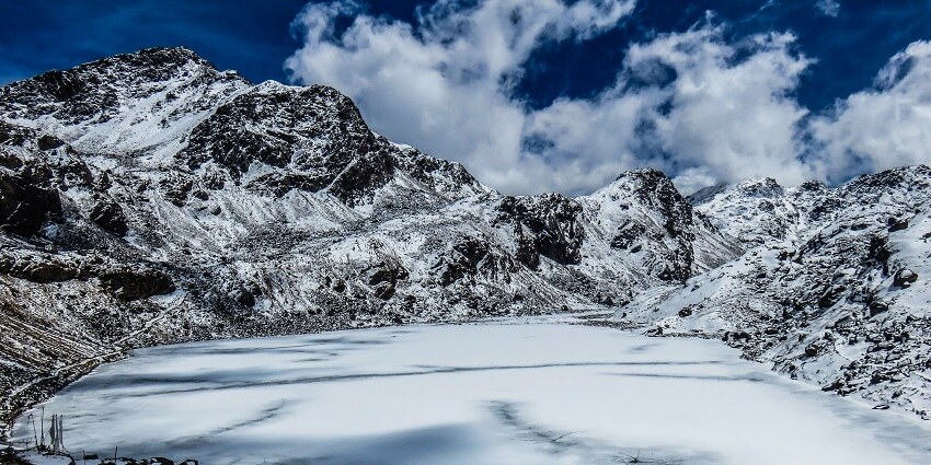 A stunning view of Gosaikunda Lake in Langtang National Park, surrounded by rugged mountains