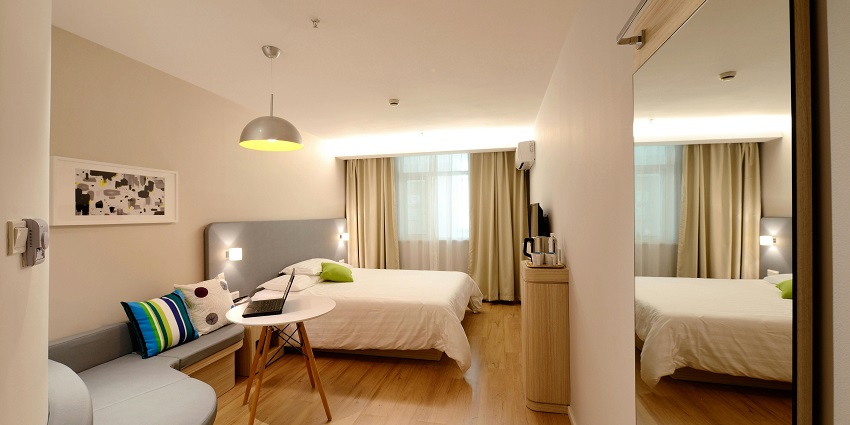 Snap of the beautifully decorated bed room having a study table ambience lightning