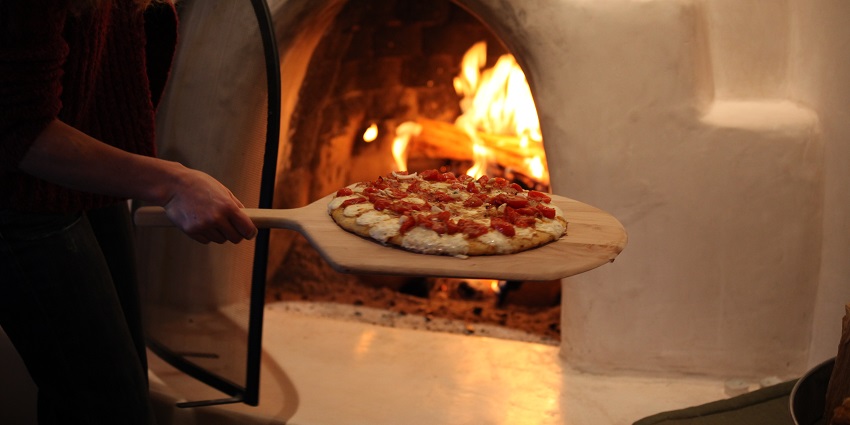 An image of woodfired pizza which is one of the best foods in Kasol, Himachal Pradesh.