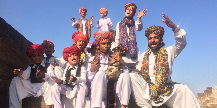 A group of folk artists from Rajasthan, getting clicked after a musical performance
