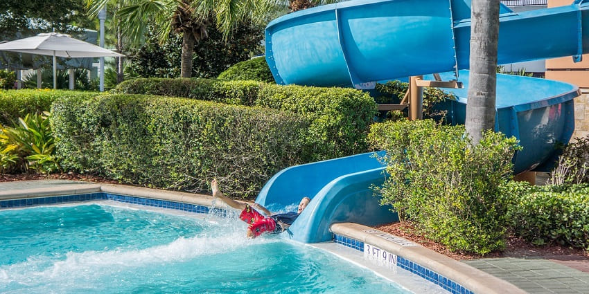 A picture of a water slide ending in a big swimming pool at a theme park in Delhi