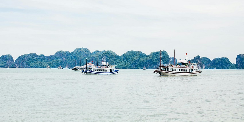 Yachts sailing on the coast of Cham Island in Vietnam