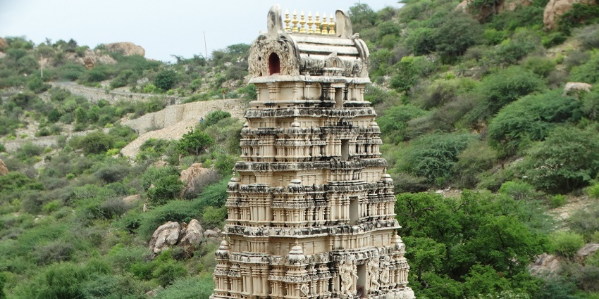 Bird eye view of the historic beautiful Yaganti Temple amidst the lush hills and trees
