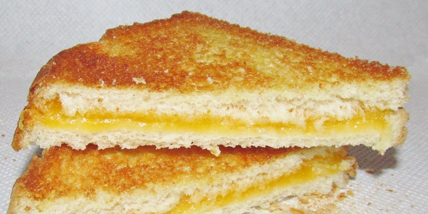 A sandwich made with locally sourced yak cheese, a unique delicacy in Kasol, India.