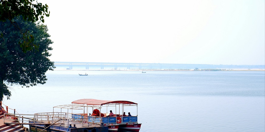 A colourful boat sailing on the glistening waters of Yanam River in Andhra Pradesh.