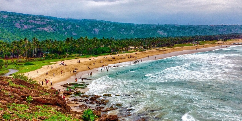A beach in Visakhapatnam with plants and flowers blooming around. Relaxing here is the best thing to do
