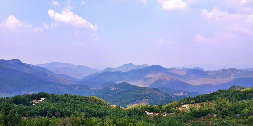 Scenic view of the lush landscapes of Yercaud with forested hills in the background