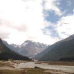 Picturesque view of the Yumthang valley, a stream meandering through the verdant landscapes