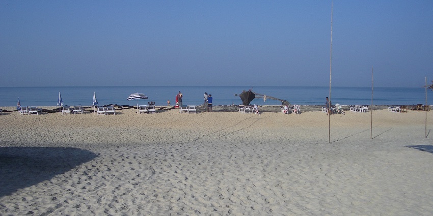 Picturesque view of Zalor beach calm and clear blue water - one of the best places to visit near Margao
