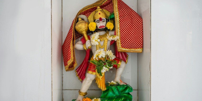 An inside view of Zand Hanuman Temple featuring a beautifully decorated Hanuman statue.