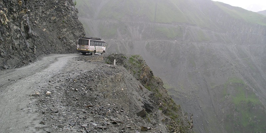 A picture of a bus seen on the Sringar-Leh Route, also known as Zojila Pass.