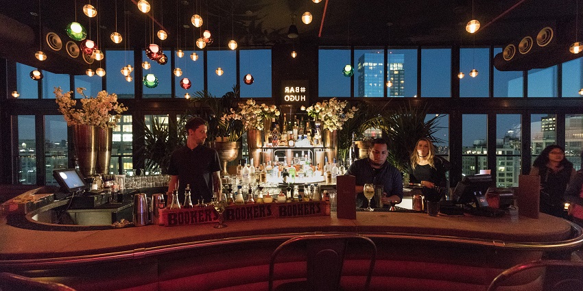 Rooftop bar with outdoor seating and a good view of buildings to enjoy nightlife in Bangkok for couples