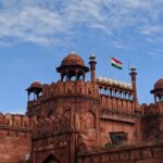 A panoramic wide angle view of the iconic Red fort in Delhi under a clear sunny sky