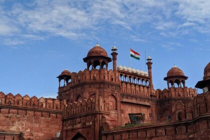 A panoramic wide angle view of the iconic Red fort in Delhi under a clear sunny sky