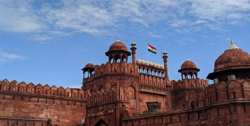 A panoramic wide angle view of the iconic Red fort in Delhi under a clear sunny sky