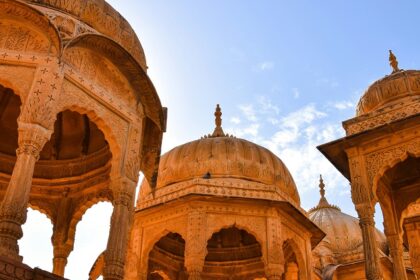 Image of Jaisalmer - explore the War Museum features a red archway, military decorations