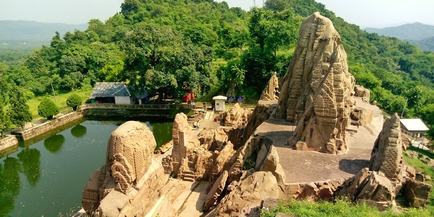 Rock-cut temple in Masroor, showcasing intricate carvings and ancient architecture.