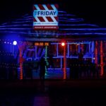 A glimpse of a restaurant in the region adorned with glistening red and blue lights.