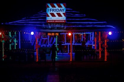 A glimpse of a restaurant in the region adorned with glistening red and blue lights.