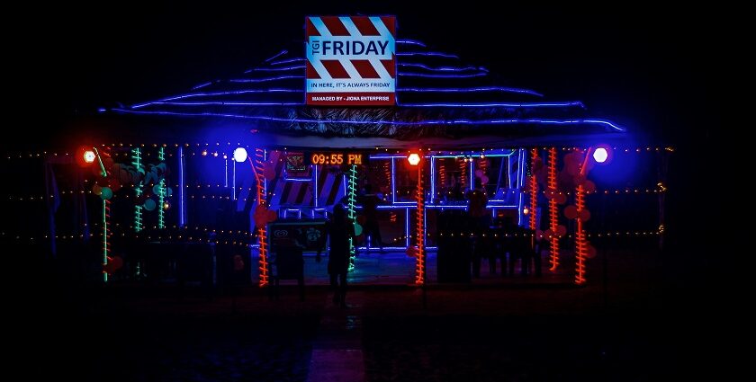 A glimpse of a restaurant in the region adorned with glistening red and blue lights.