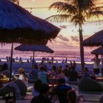 View of a vibrant beachside restaurant at sunset, offering into a glimpse of night life in north Goa