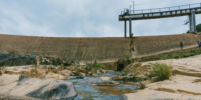 A small dam near Jatashankar Temple, surrounded by greenery and natural scenery