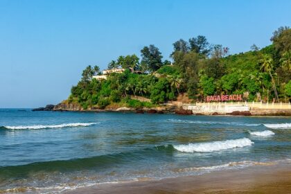 Image of Beautiful Baga beach with waves lapping up onto the shore in a perfect sunny day