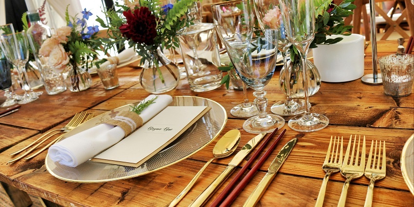 Dinner tables adorned with luxurious decorations served before a party in Jaipur