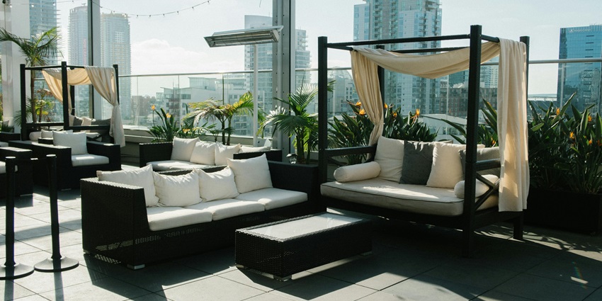 Image of white and black couch - AER, Rooftop Lounge, one of the best places to visit in mumbai in summer