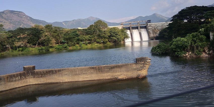 A picturesque reservoir with rolling hills and lush greenery, offering a peaceful retreat, one of the best places to visit in Karur.