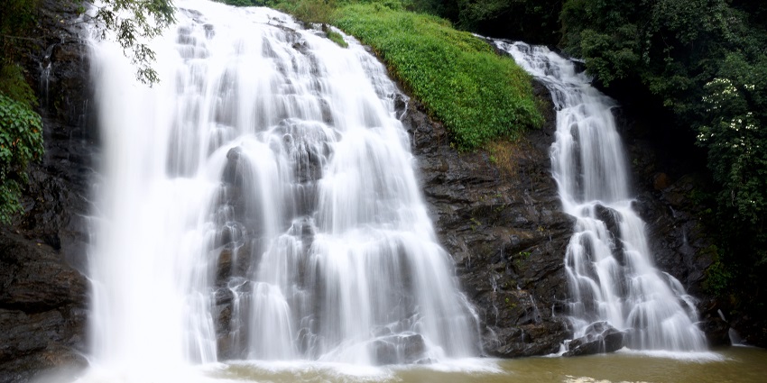 a popular waterfall in Kodagu district. River Kaveri drops for about 70 ft over wide rocks.